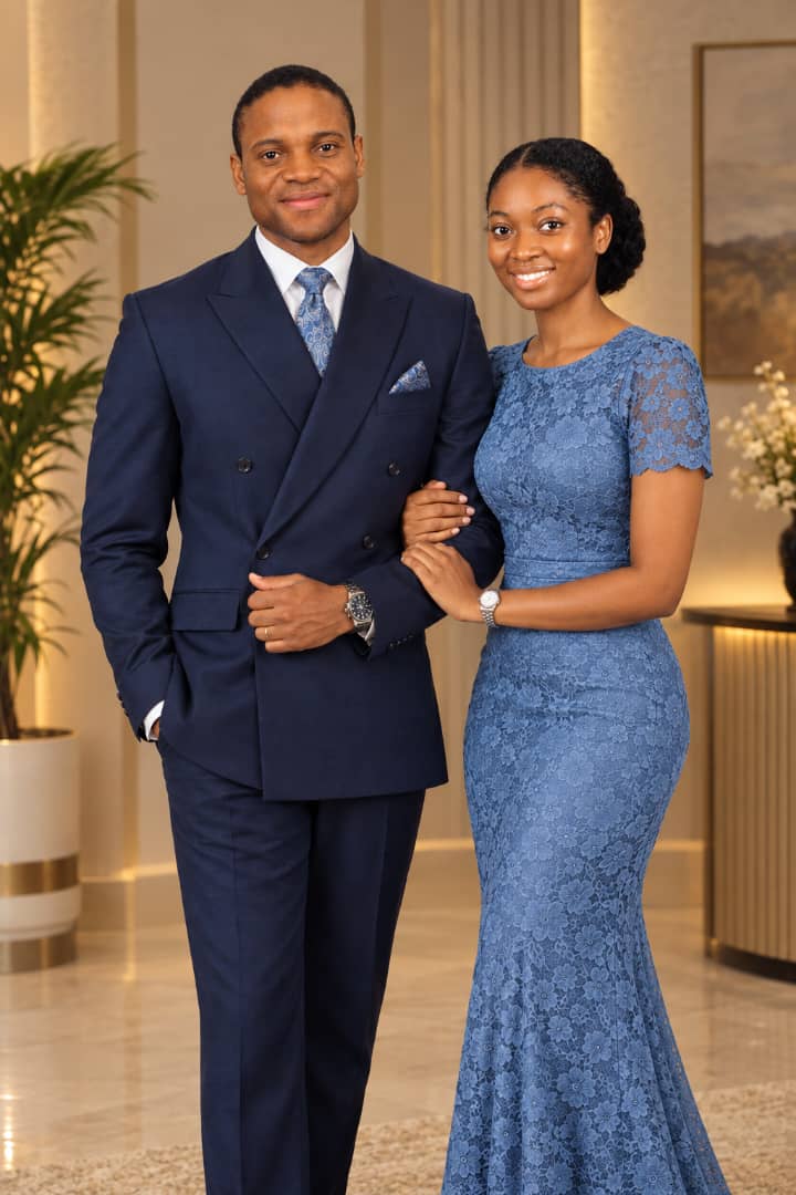 Joy and Ayoola standing together in blue formal outfits